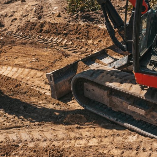 Close-up of an excavator wheels on a construction site